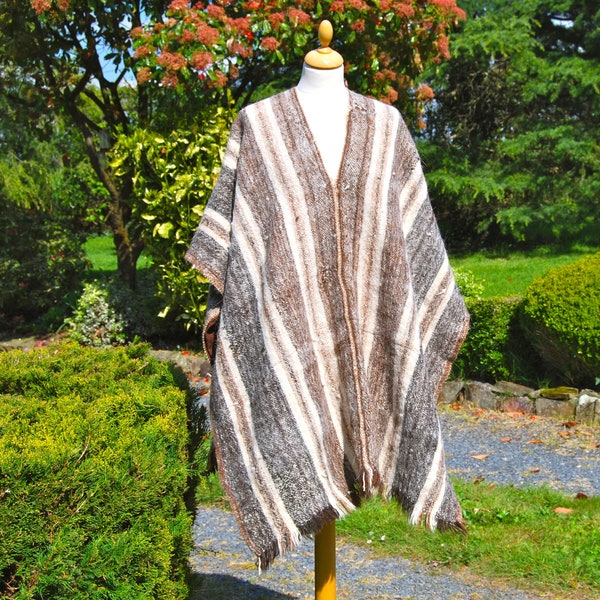 Vintage 1970’s indigenous handwoven alpaca poncho. Hand-crafted 100% Bolivian  poncho with tassled fringing, natural colouring, one size.