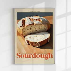 Könnte beinhalten: Ein Poster mit einem Foto eines Sauerteigbrotes auf einer Holzoberfläche. Das Poster trägt den Text "The Kitchen Diary" und "Sourdough Bread Club" in Orange.