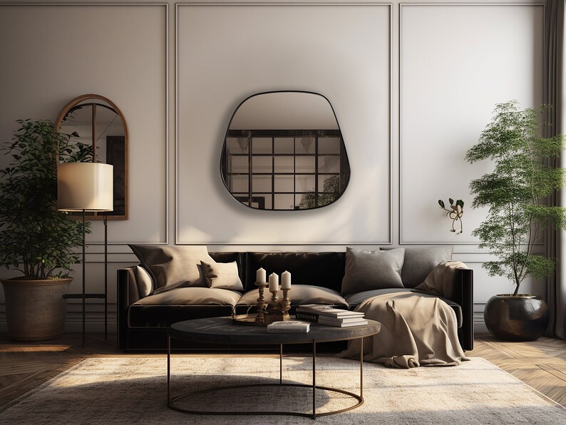 May include: A modern living room interior with a black, irregularly shaped wall mirror, a brown velvet sofa with throw pillows, a round coffee table, a floor lamp, and two potted plants.