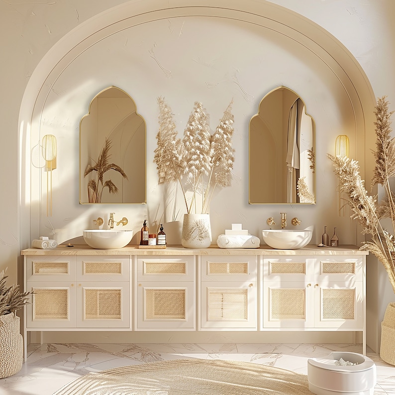 Two Accent Mirrors with gold frame finish hung on the wall of a powder room over a double vanity.