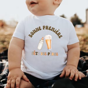 フランス語で書かれた赤ちゃん用父の日Tシャツ。フランス語で父の日。「Première Fête des Pères（父の日初登場）」Tシャツまたはボディスーツ。フランス語教師への父の日ギフト。