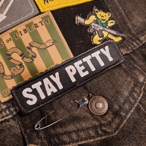 May include: A set of three ceramic mugs with a speckled, matte finish. The mugs are in shades of cream, light brown, and dark brown. Each mug has a simple, minimalist design, perfect for coffee or tea.