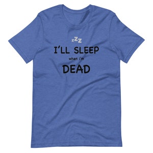 May include: A blue t-shirt with the text "I'll sleep when I'm dead" and "zzz" above the text.