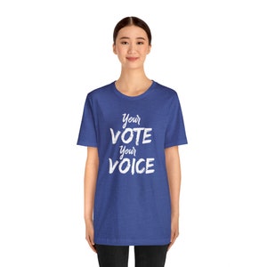 May include: A royal blue t-shirt with the text "Your Vote Your Voice" in white lettering.