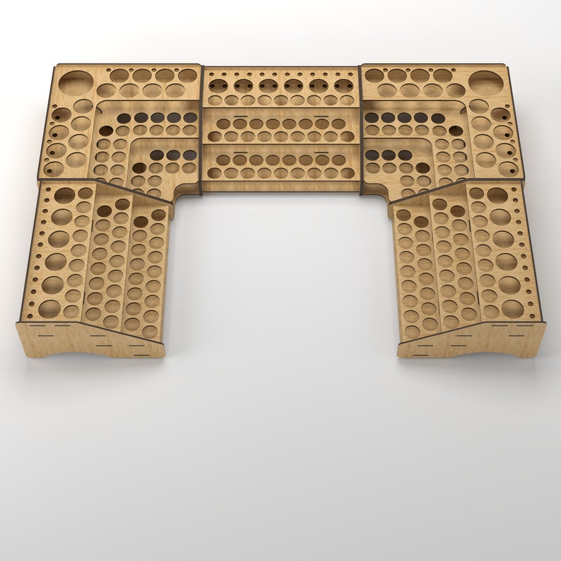 May include: A wooden paint rack with multiple shelves and rows of circular holes for storing paint bottles. The rack is in the shape of a U and is made of light brown wood.