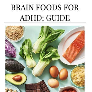 May include: An overhead shot of various foods, including salmon, eggs, avocado, and chocolate, arranged on a light blue surface. The text "BRAIN FOODS FOR ADHD: GUIDE" is at the top. The website address www.giveyourselfgrace.coach is at the bottom.