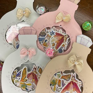 Holografische feeënstickers: vinyl elfenstickers in fles
