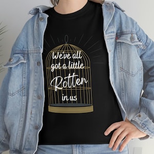 Plated Prisoner Series, Raven Kennedy, Auren Slade, Commander Rip King Rot, Gild Gleam Glint Glow Goldfinch, Women's Unisex Cotton Tee Shirt