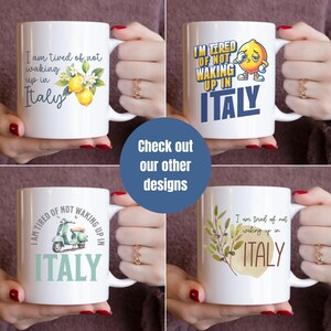 May include: Four white ceramic mugs with different designs featuring the text "I am tired of not waking up in Italy". The designs include lemons, a cartoon lemon, a scooter, and olive branches.