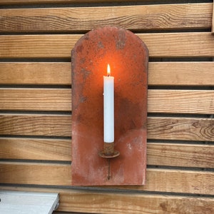 Rostige kerzenhalter