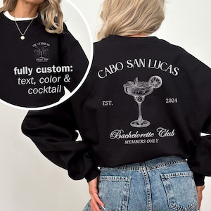 Puede incluir: Sudadera negra con texto blanco que dice "CABO SAN LUCAS EST. 2024 Bachelorette Club MEMBERS ONLY" y un gráfico de una copa de margarita con una rodaja de lima.