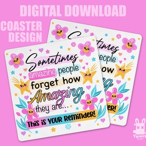 May include: A white coaster with a pink, yellow, and blue floral design. The coaster features the text "Sometimes amazing people forget how amazing they are... This is your reminder!"