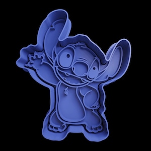 May include: Blue plastic cookie cutter shaped like Stitch from the Disney movie Lilo & Stitch. The cutter is detailed with Stitch's signature features, including his big eyes, goofy grin, and three-fingered hand.