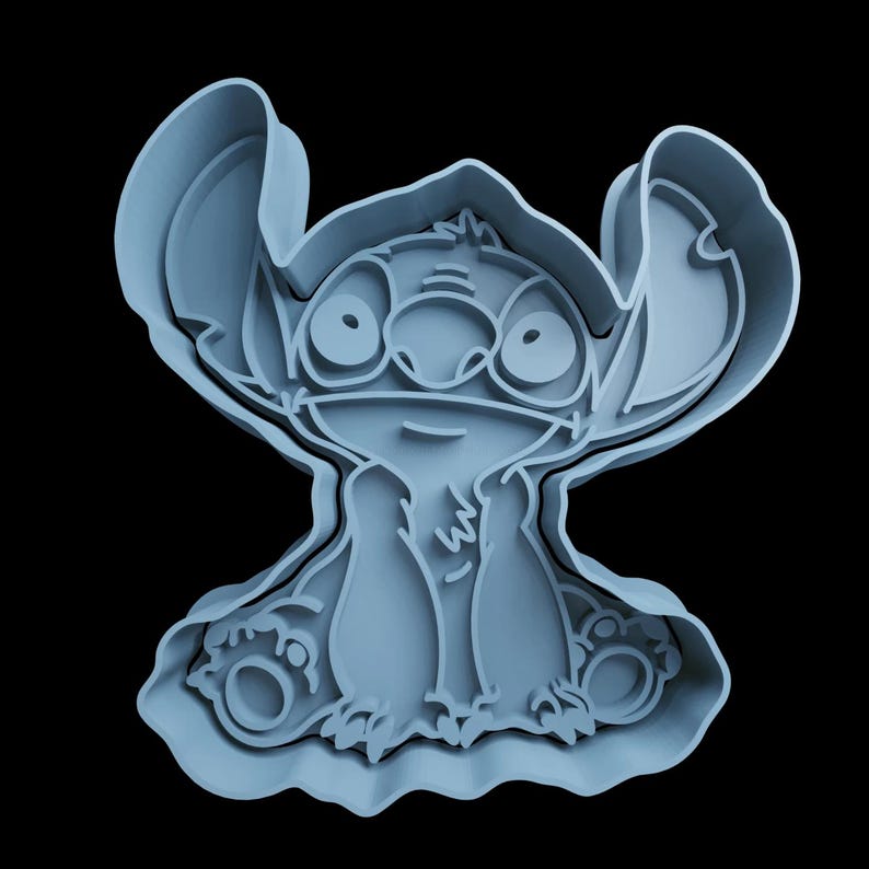 May include: A blue plastic cookie cutter shaped like Stitch from the Disney movie Lilo & Stitch. The cutter is detailed with Stitch's signature features, including his big eyes, ears, and mischievous grin.
