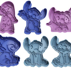 May include: Six blue and purple plastic cookie cutters shaped like Stitch from the Disney movie Lilo & Stitch. The cutters are in various poses, including standing, sitting, and waving.