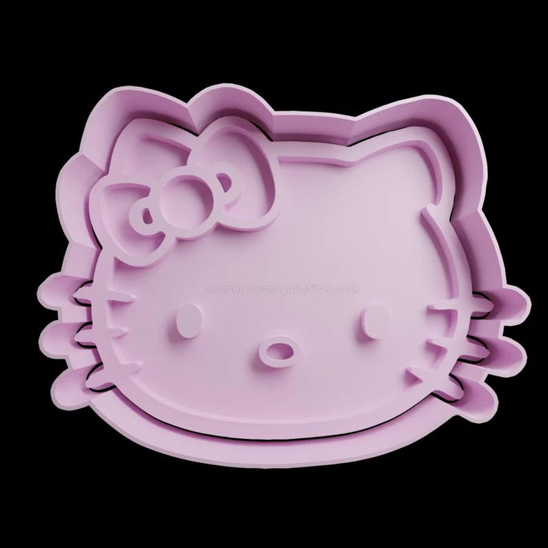 May include: A light purple plastic cookie cutter shaped like Hello Kitty. The cutter has a bow on top of her head and a small nose.