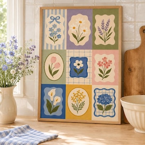 Puede incluir: Una lámina decorativa rectangular en un marco de madera clara que presenta una cuadrícula de nueve paneles florales ilustrados. Cada panel muestra una flor diferente, incluyendo margaritas, tulipanes, lavanda y hortensias sobre fondos pastel.