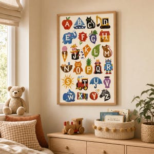 May include: A rectangular wall poster featuring a colorful alphabet illustration with letters A through Z, each paired with a corresponding object like an apple, boat, cat, and zebra, all set against a cream background in a light wood frame.
