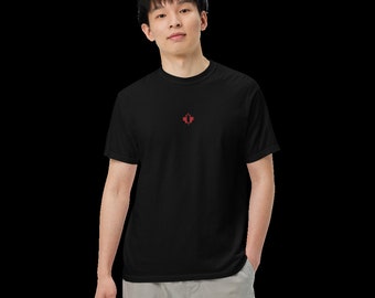 May include: A black t-shirt with a red maple leaf design on the front.