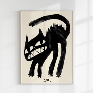 May include: A black and white illustration of a cat with a menacing expression. The cat is drawn in a simple, stylised manner and is set against a beige background. The text "CAT." is printed below the cat.