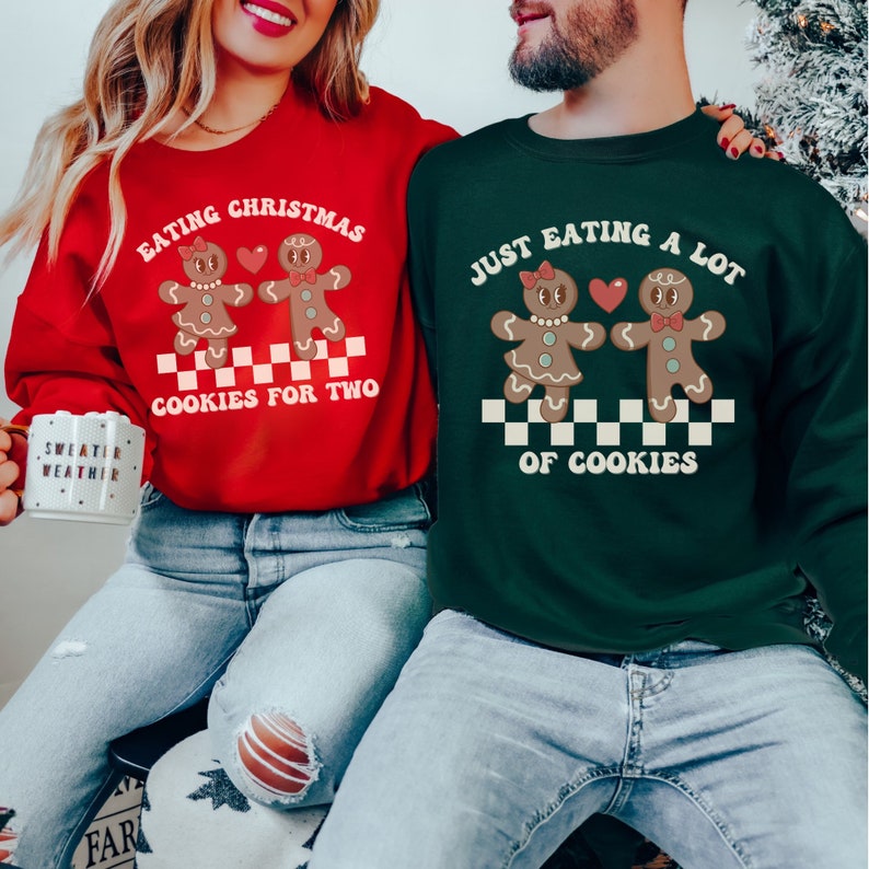 May include: A red and green Christmas sweater set featuring gingerbread people and the text "Eating Christmas Cookies for Two" and "Just Eating a Lot of Cookies".