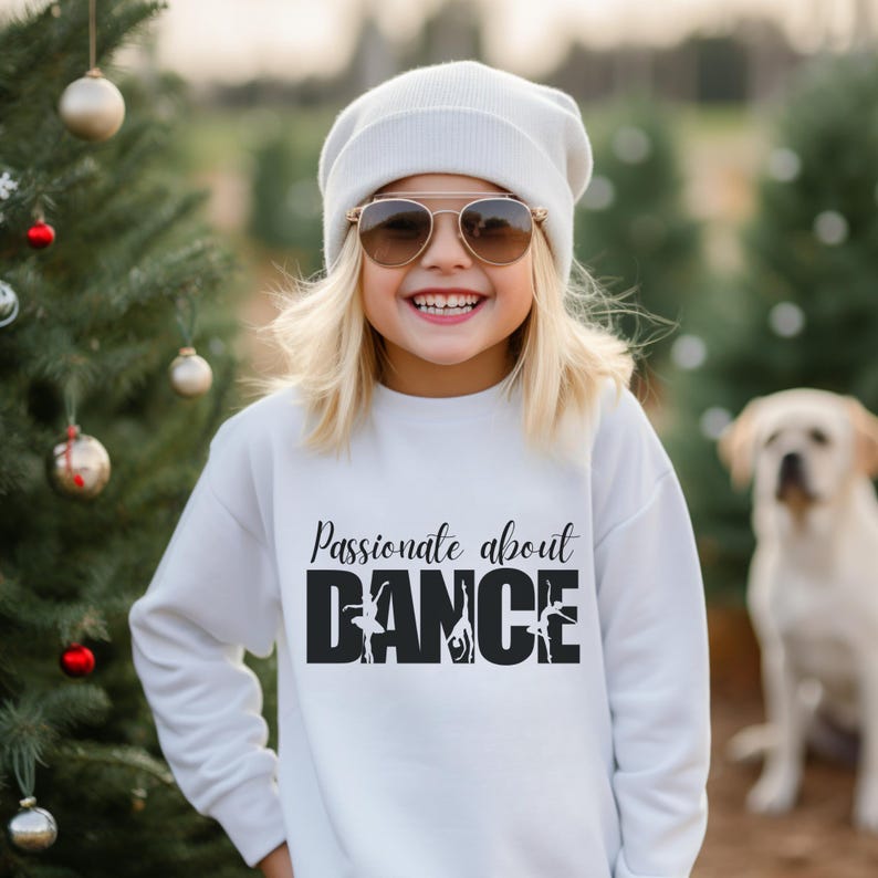 May include: A white sweatshirt with black text that reads "Passionate about DANCE" with a silhouette of dancers in the word "DANCE".