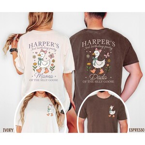 May include: Ivory and espresso-colored t-shirts with a whimsical goose design. The shirts feature text that reads "Harper's 3rd birthday party" and "Mama" or "Dada" below the goose illustration. The goose wears a bow and boots.