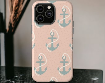 May include: A phone case featuring a repeating pattern of teal anchors with white rope on a light pink background with small white dots. The case has a black camera module and black side buttons. The case is on a black surface.