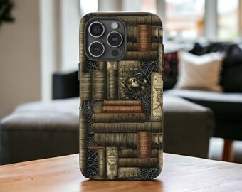 May include: A black phone case with a design of old books and cobwebs. The case has a camera lens cutout and a pattern of books and cobwebs.