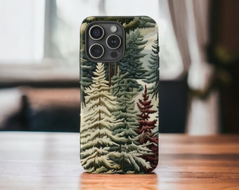 May include: A phone case featuring a detailed forest scene with evergreen trees in shades of green, white, and burgundy. The case has a matte finish and a camera cutout.