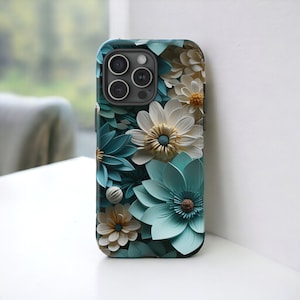 May include: A phone case with a floral design featuring blue, white, and yellow flowers. The case has a cutout for the phone's camera.