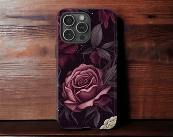 May include: A black phone case with a dark floral design featuring a large pink rose and smaller pink flowers. The case has a camera cutout with three lenses.