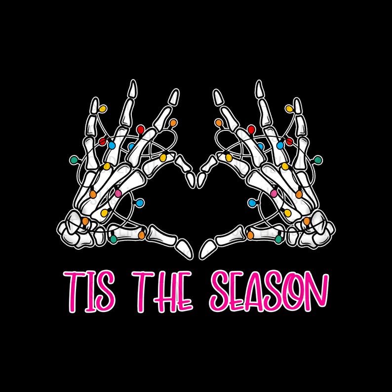 May include: A graphic design featuring two white skeleton hands forming a heart shape, adorned with colorful Christmas lights. The phrase "TIS THE SEASON" is written in pink below the hands, set against a black background.