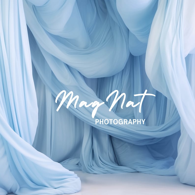 May include: A light blue fabric backdrop with the text "Mag Nat PHOTOGRAPHY" in white.
