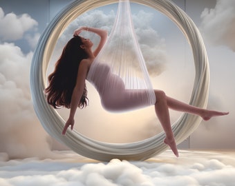 Può includere: Una donna incinta con un vestito bianco trasparente è seduta su un'altalena circolare bianca appesa al soffitto. L'altalena è circondata da nuvole bianche.