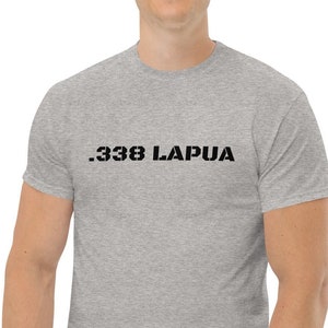 May include: A heather grey t-shirt with the text ".338 LAPUA" printed in black.