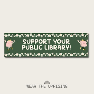 May include: Green banner with white daisies and the text "SUPPORT YOUR PUBLIC LIBRARY!" with a cartoon book character on each side.
