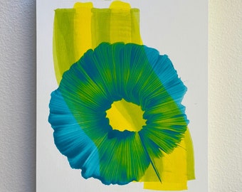 May include: Abstract painting on white canvas. The artwork features a central teal and green circular shape with a yellow center, overlaid by yellow and green brushstrokes. The artist's signature, "neha '22", is in the lower right corner.