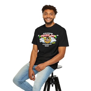 May include: A black t-shirt with a graphic print of a cartoon character in a cloud with the text "Summer Jam" and "Wu-Tang Clan Summer Jam Concert" in smaller text below.