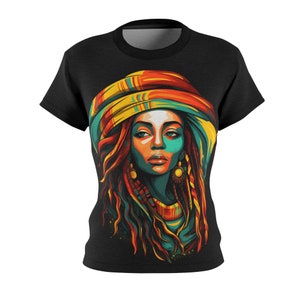 May include: A black t-shirt featuring a colourful illustration of a woman wearing a patterned head wrap and long dreadlocks. The woman's face is painted in shades of blue, green, and yellow.