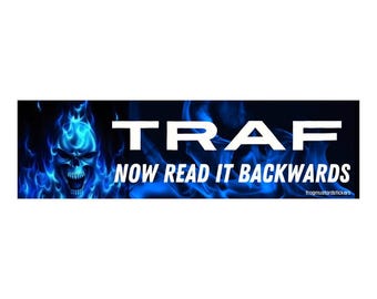 May include: A rectangular sticker with a blue flaming skull on the left and the word "TRAF" in white block letters. Below, the text reads "NOW READ IT BACKWARDS". The sticker has a dark blue background.