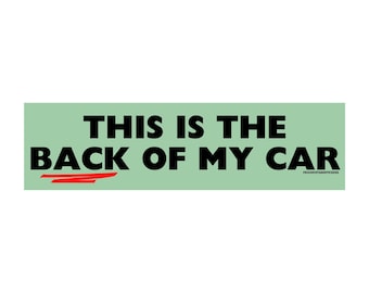 May include: A rectangular bumper sticker with the text "THIS IS THE BACK OF MY CAR" in black, on a light green background. A red line underlines the word "BACK". The sticker is designed to be placed on the rear of a vehicle.
