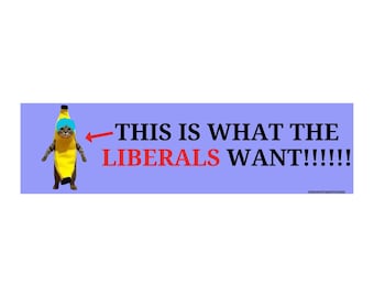 May include: A rectangular sticker with a light purple background. The sticker features a cat dressed as a banana with a blue hat. Text reads "THIS IS WHAT THE LIBERALS WANT!!!!!!" with "LIBERALS" in red.