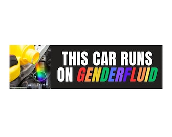 May include: A black rectangular sticker with the text "THIS CAR RUNS ON GENDERFLUID" in white, with "GENDERFLUID" in rainbow colors. The left side shows a car engine being filled with rainbow-colored fluid.