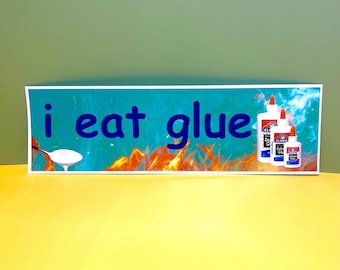 May include: A rectangular sign with the words "i eat glue" in blue letters. A spoon with white glue is on the left. Elmer's glue bottles are on the right. The background is teal with orange flames.