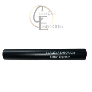 May include: Black tube with white text that reads "Celestial Emporium" and "Better Together".