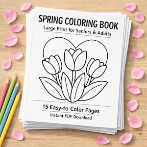 May include: A stack of white paper coloring books with the text "SPRING COLORING BOOK" and "Large Print for Seniors & Adults". The cover features a tulip design. Pink petals and colored pencils are scattered around the books.