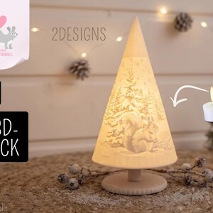 May include: A conical 3D-printed lamp featuring a detailed relief of a squirrel in a snowy forest. The white lamp stands on a circular base and is illuminated by a small LED tea light. Text on the image includes 2DESIGNS, .STL, and 3D-DRUCK.
