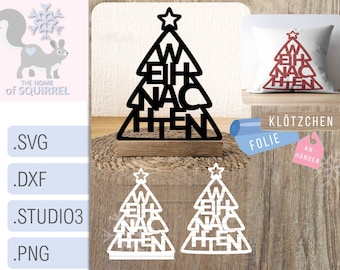 May include: A black wooden Christmas tree cutout with the word "Weihnachten" written on it. The tree is on a wooden base and is surrounded by a brown wicker mat. There are two white Christmas tree cutouts with the same text on a white background.