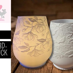 May include: Two ceramic vases with floral designs. One vase is lit from within, casting a warm glow, while the other is unlit. The vases are white with embossed floral patterns. The image also includes a logo with a squirrel and the text ".STL 3D-DRUCK."